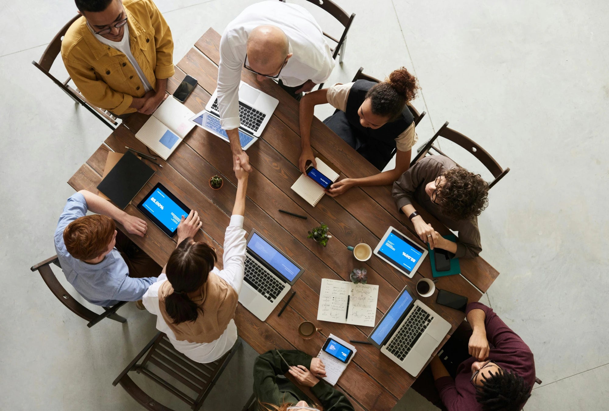 Overhead image of Addison Application employees working.